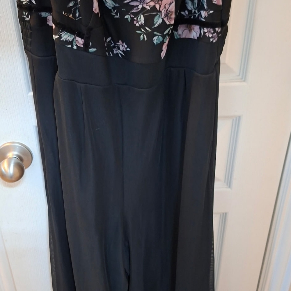 This is a Torrid black floral wide leg challis jumpsuit with a mesh overlay on t - Picture 3 of 5